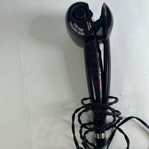 Infinity pro curling iron curls hair with push of button purple